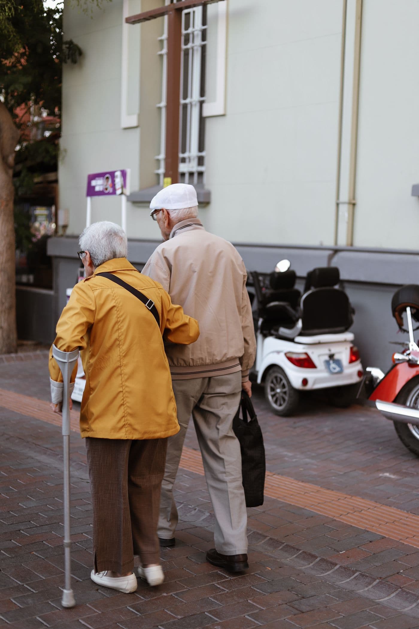Attendant helping an ambulatory passenger walk