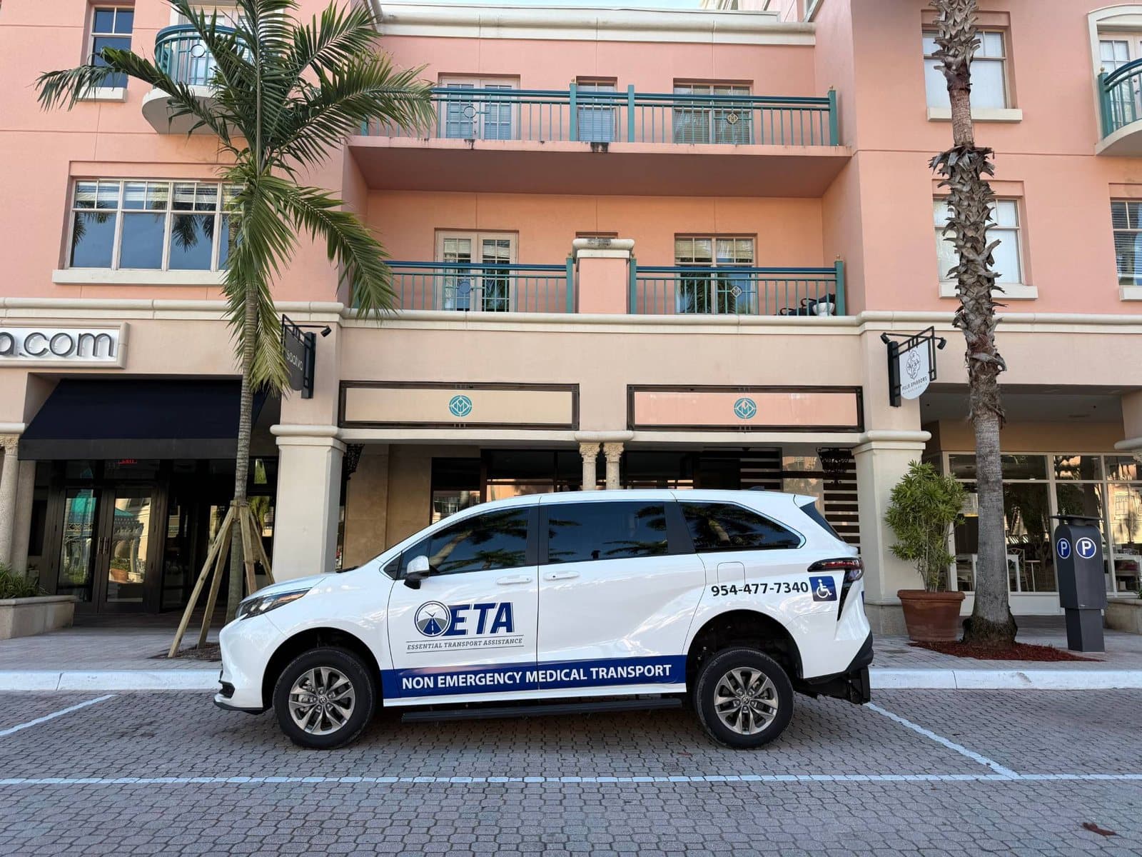 Essential Transport Assistance wheelchair-accessible minivan parked at Mizner Park in Boca Raton